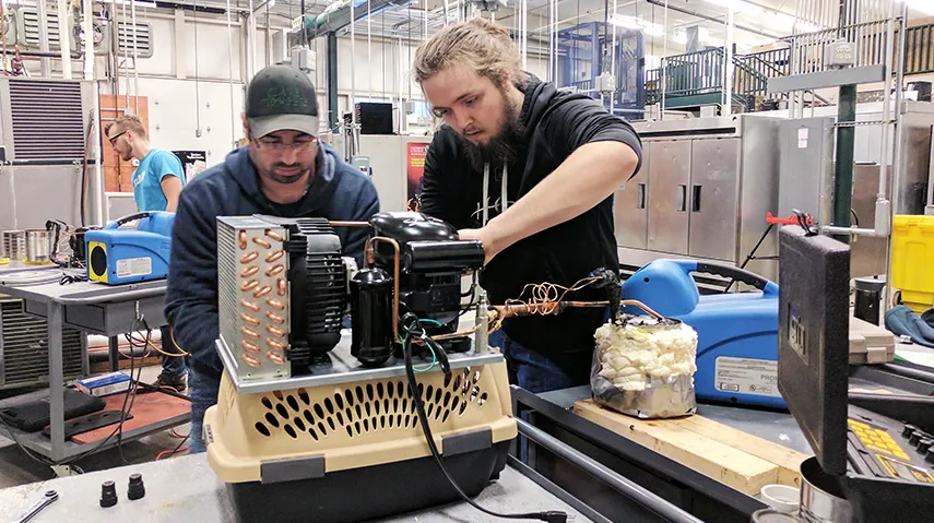 Students working on hvac machinery