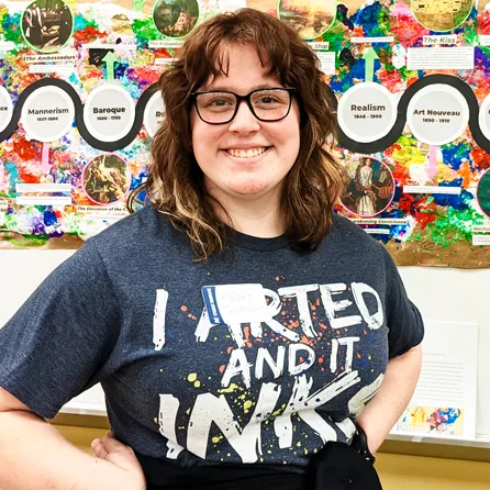 Amber stands in front of her recently completed art timeline project.