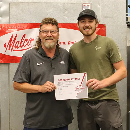 Colby Brown accepts Malco Tools Head of the Class Award from HRA Instructor Ron Holmes.